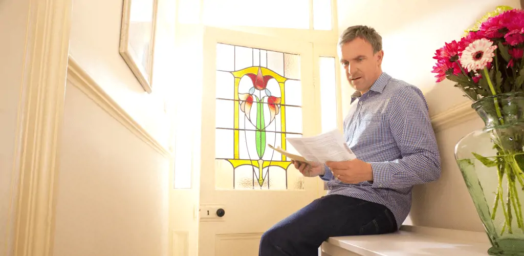 Confused man with insurance policy